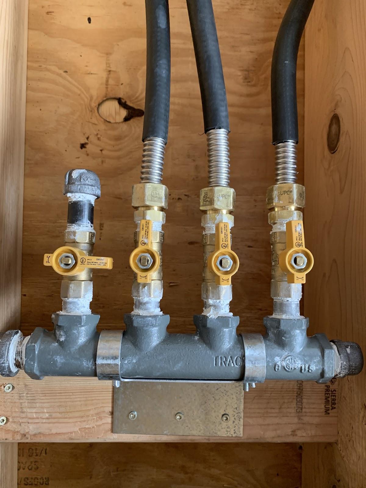 Four valve gas manifold installed with clean copper and steel work